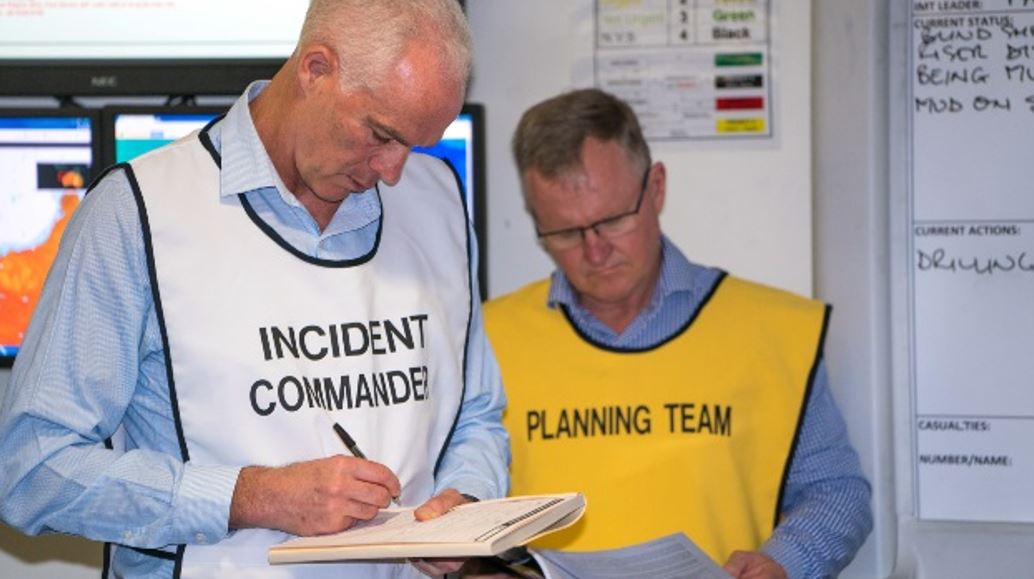 High-level decision-making during the MEER exercise is depicted as the incident commander and planning team coordinate oil spill response strategies. This reinforces the structured leadership crucial for emergency scenarios.