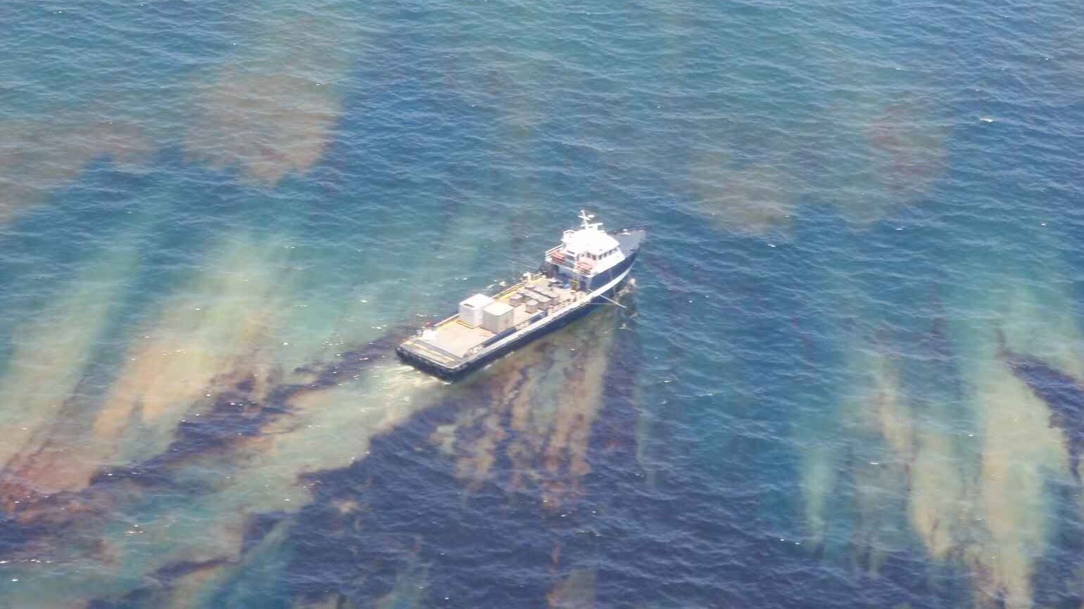 A vessel spraying dispersant in oiled water during the Macondo Deepwater Horizon's Subsea Blowout oil spill in 2010.