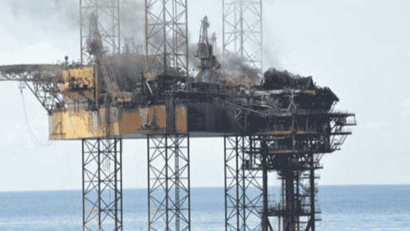  A burning offshore rig in the Timor Sea following a well control failure, causing a large-scale oil spill.