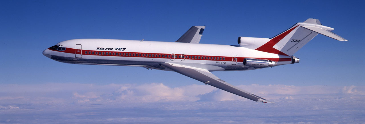 Stock image of a Boeing 727 in its original commercial configuration, used for reference or legacy context before OSRL's custom modification for oil spill response.