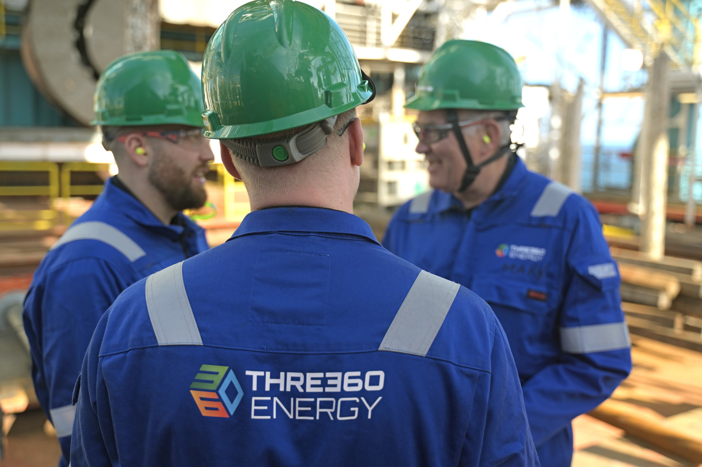 Team members from THREE60 Energy engage in on-site planning and coordination, illustrating human factors and decision-making.