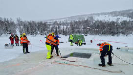 Responders conducting a cold-weather preparedness exercise on ice