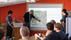Oil spill response professionals receiving incident management training with a focus on mapping and emergency decision-making.