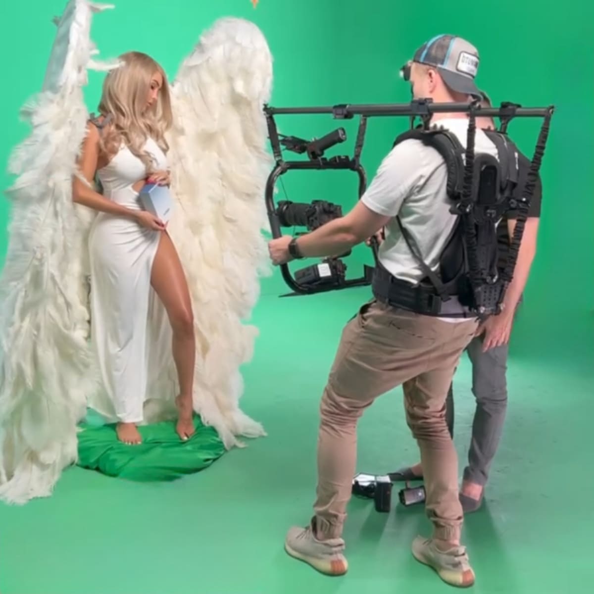 Behind the scenes: a set being lit and adjusted before the frame is taken.