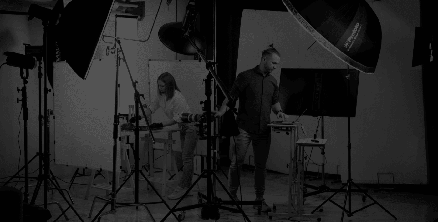The studio floor mid-shoot, with lighting rigged around a product table.