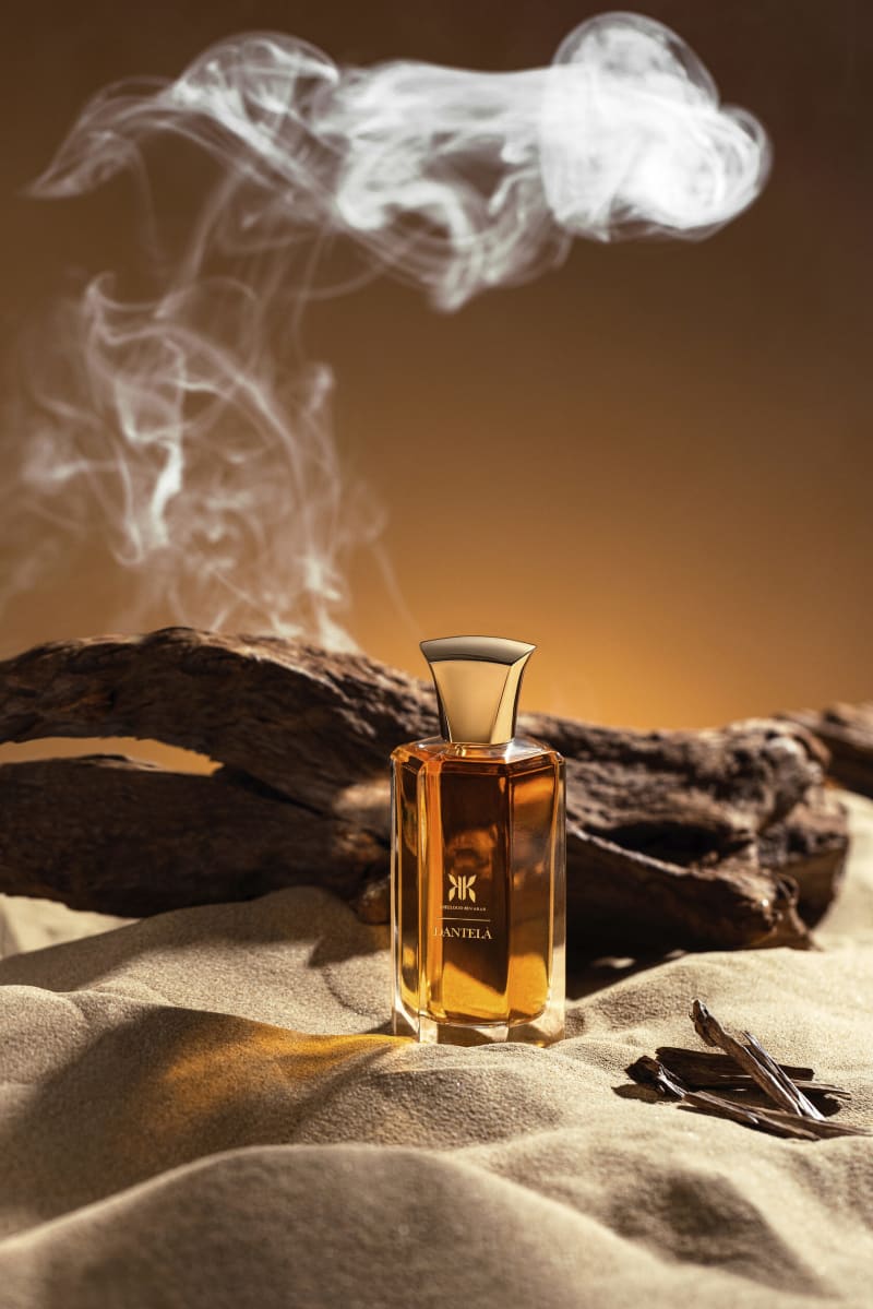 A product photographed mid-splash against a graded backdrop.