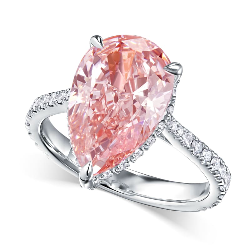 A pear-cut pink diamond ring photographed on white for e-commerce.