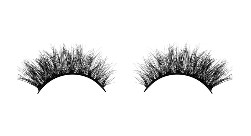 Two pairs of false lashes arranged on white.