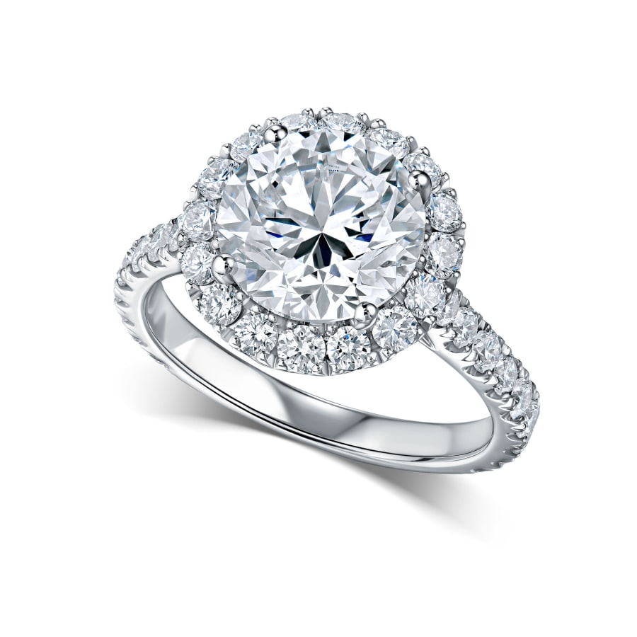 A solitaire diamond ring photographed on pure white for an e-commerce listing.
