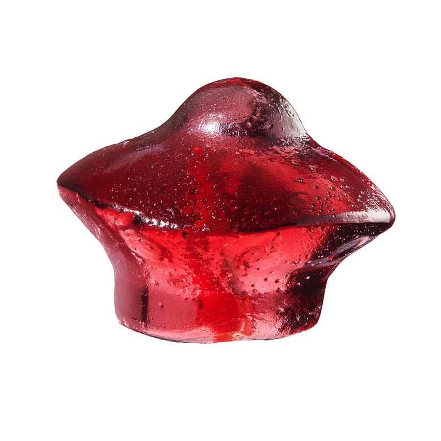 A glossy red jelly photographed on white with texture detail.
