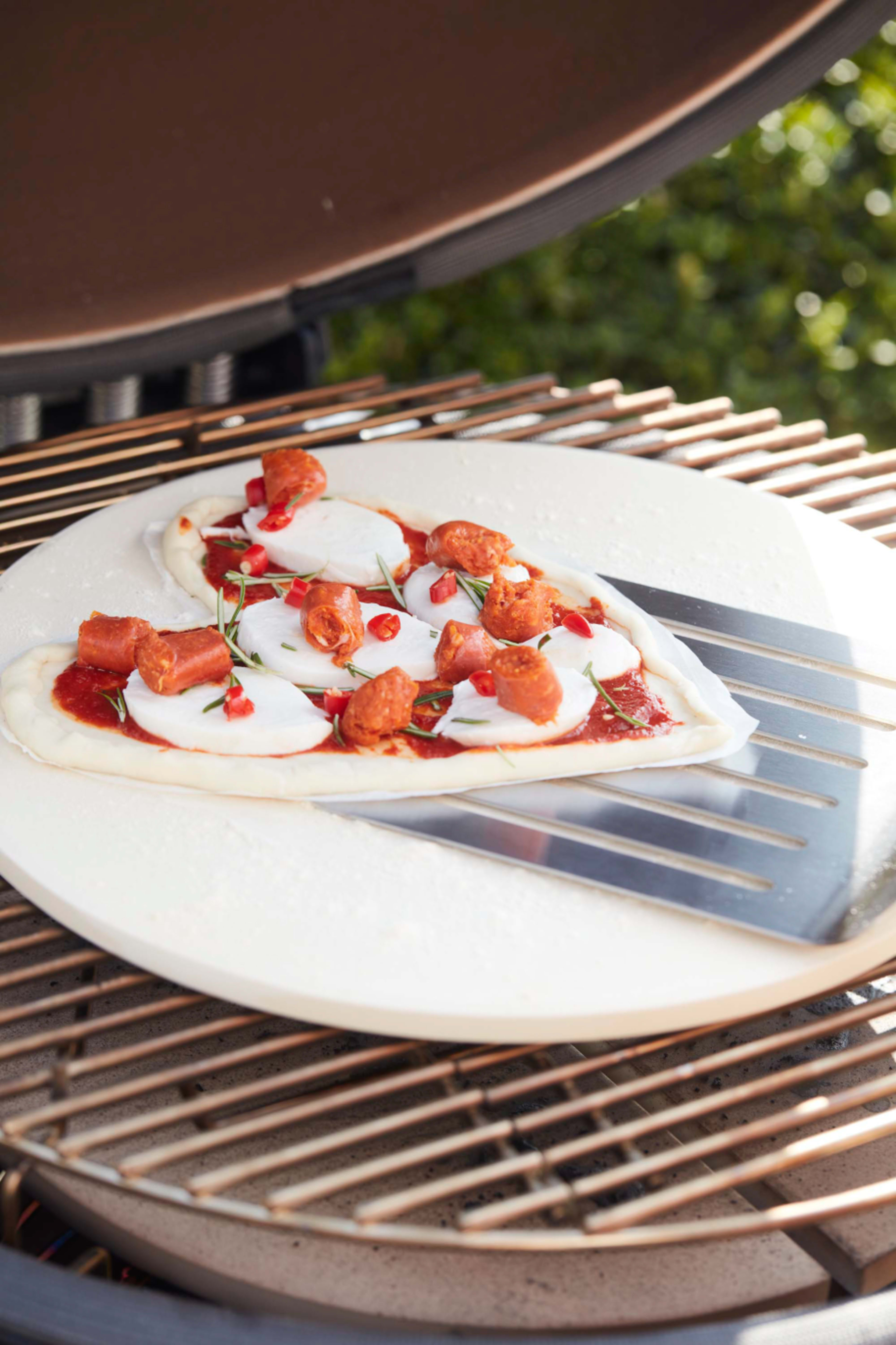 Universal pizza stone made of refractory clay