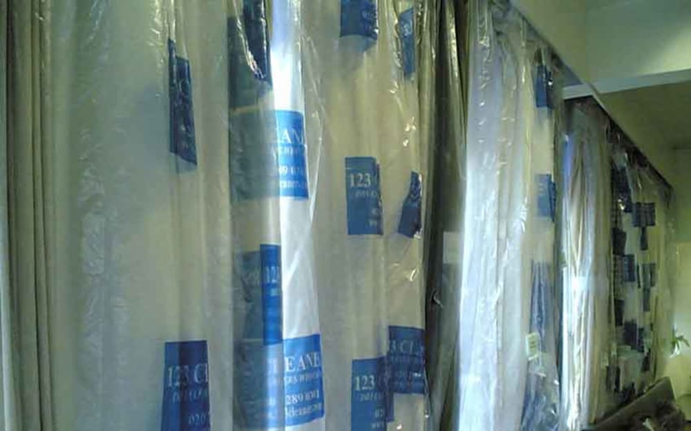 Hanging Curtains after Dry Cleaning to keep the pleats in shape by 123 Cleaners