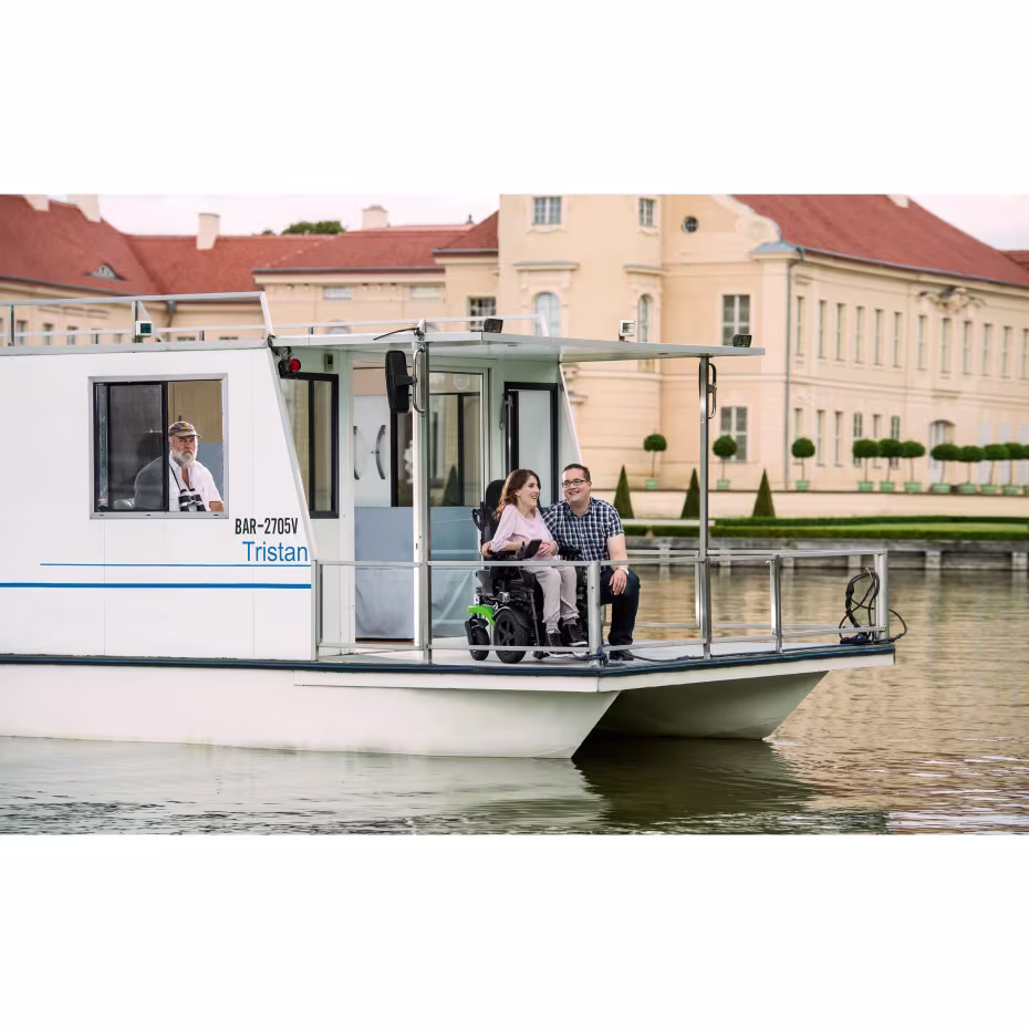Nadine with her Juvo and her husband on a houseboat.