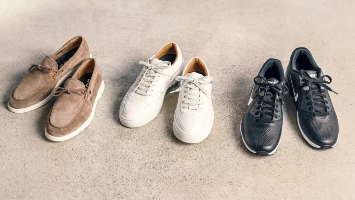 Three pairs of men's shoes lined up side by side.