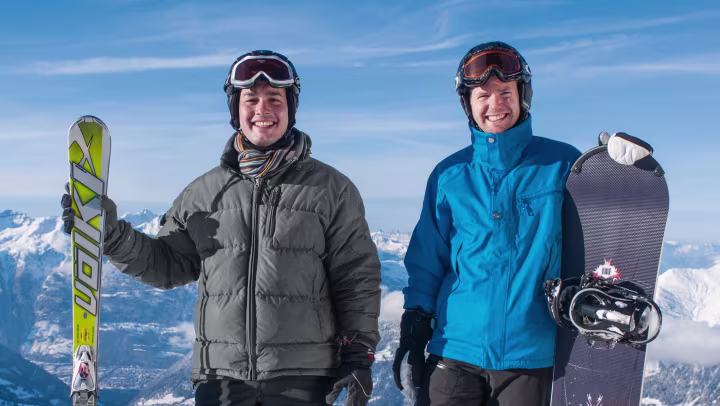 John and his friend on ski and snow board.