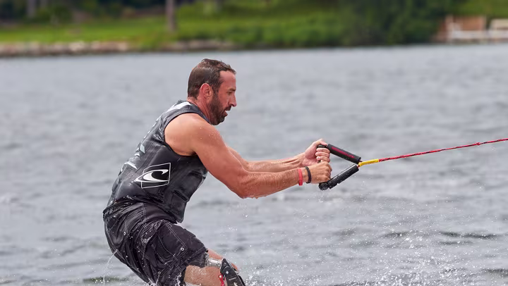 Men is wakeboarding with a ProCarve. 