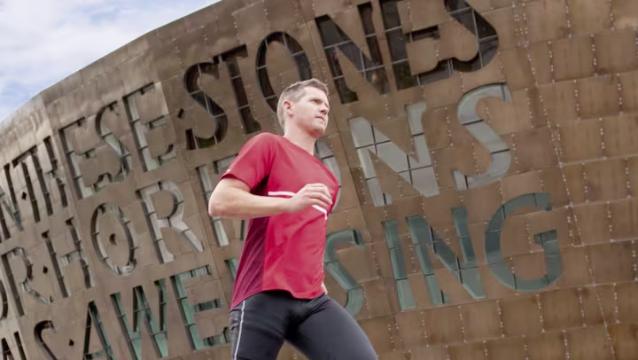 John jogs through town.