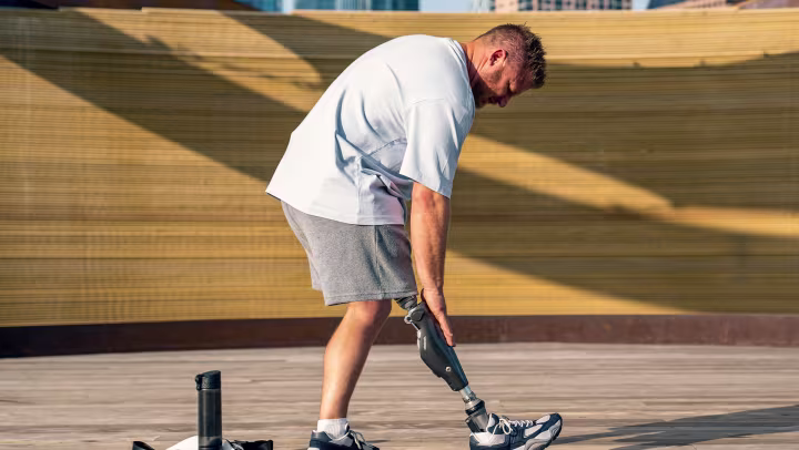 A C-Leg user taps his C-Leg before exercising.