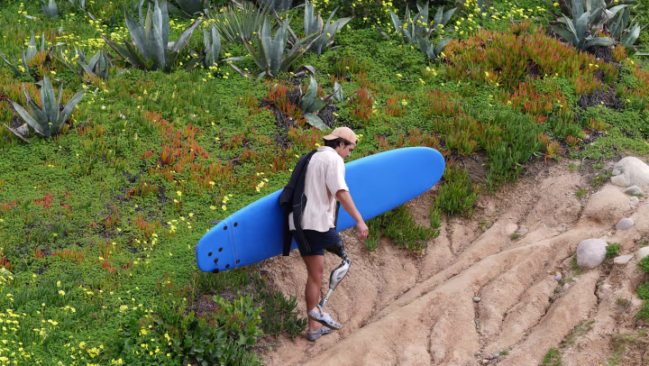Genium X4 user Caleb walking up a slope