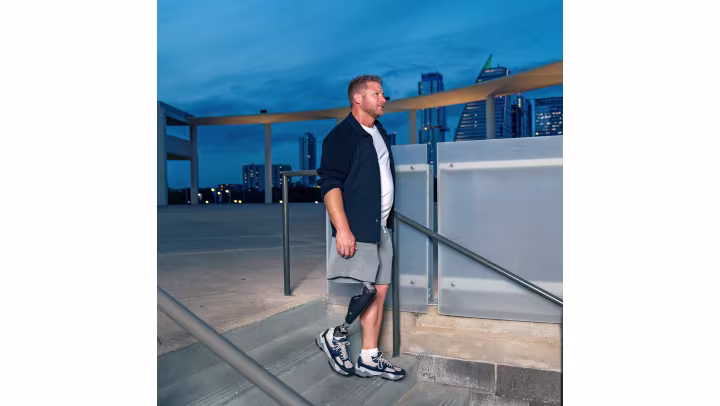 A user with the C-Leg leg prosthesis walking down a staircase.