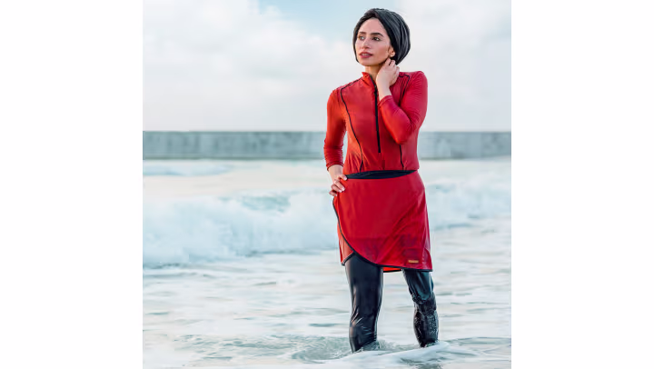 Genium X3 user Zainab standing in shallow water