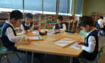 J. Addison School - Montessori students work individually and also with each together. 