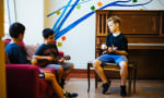 OMS Montessori - Upper Elementary Students playing Ukulele in the common area 