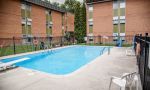 Nancy Campbell Academy - Pool with BBQ patio at the residence.  