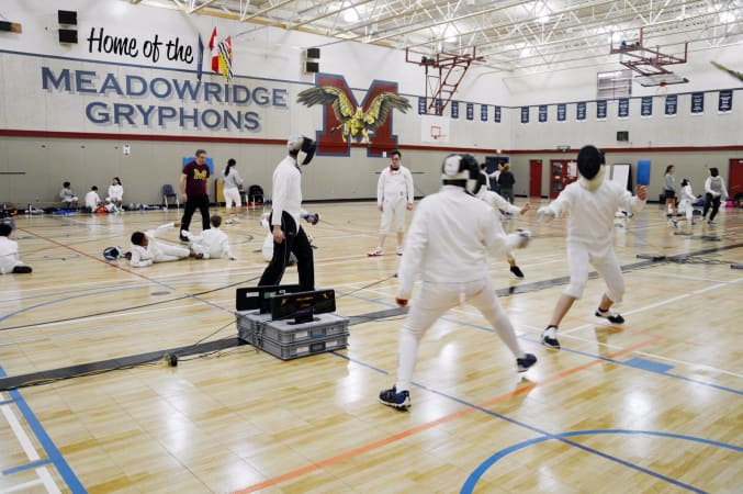 Meadowridge School - Our fencing team competing in the Gym. 