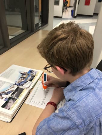 Foothills Academy - Student using assistive technology smart pen 