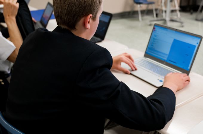 Clear Water Academy - Student working with a computer 