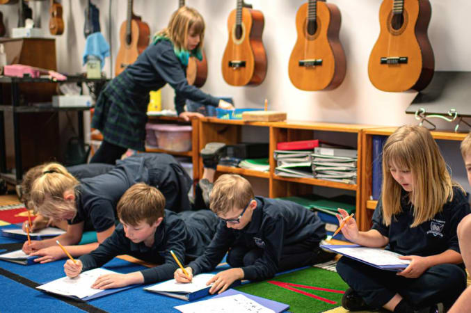 Lee Academy - Our Music Room displaying our class sets of ukuleles and guitars.  