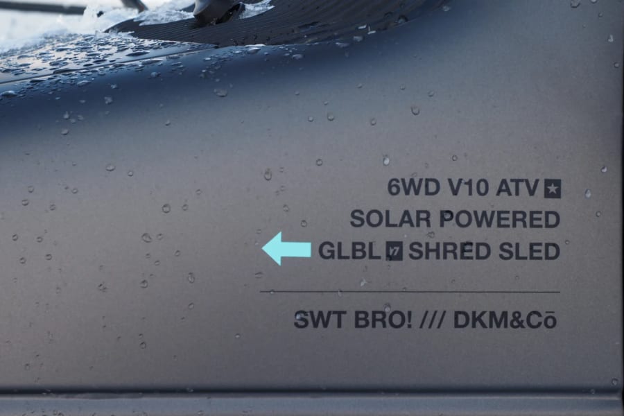 An off-road 6WD V10 solar-powered 'Shred Sled' vehicle, seen wet, great for your adventure rv rental.