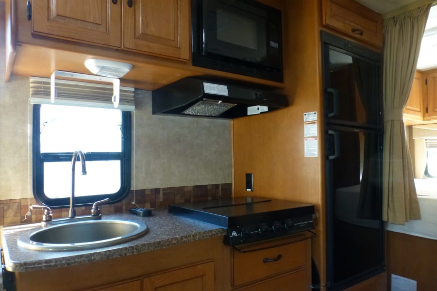 deep sink, 3 burner LP stove top, convection/microwave, 2-door fridge/freezer