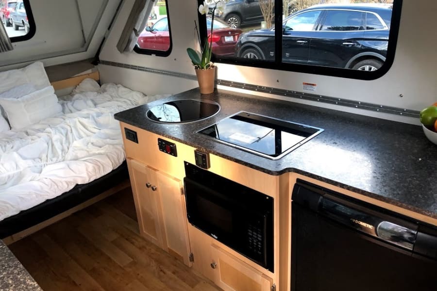 sink, gas range, microwave and refrigerator