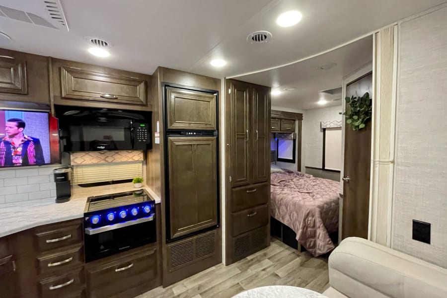 Looking at the ceiling shows where the accordion door separates the bedroom/bathroom from the rest of the cabin 