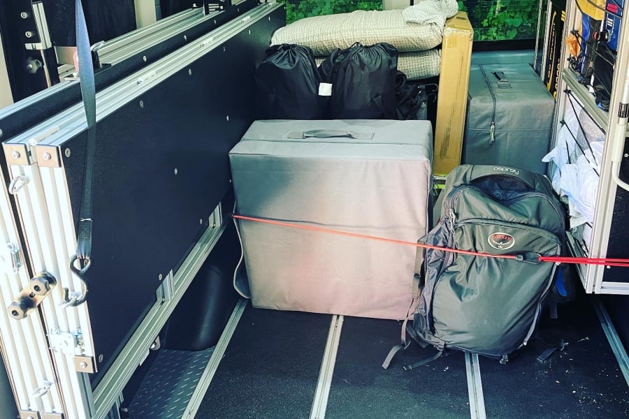 Beds stored for maximum space while traveling and gear secured