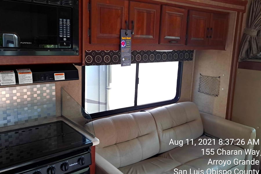 Micro wave oven, three burner stove and plenty of seating.