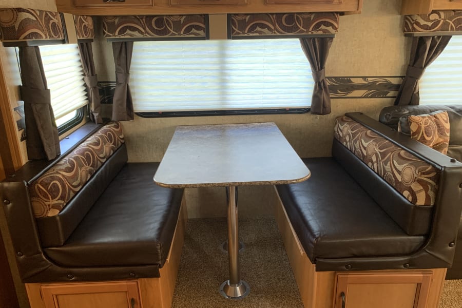 The dinette turns into a sleeping space. There is storage under the dinette and above. Bins are provided if you would like to use it as a pantry.