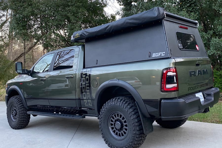 This rugged Ram Power Wagon pickup, equipped with an overland Go Fast Camper, is perfect for your next off-road adventure or RV rental.