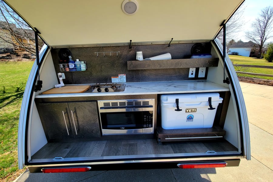 Full kitchen with dishes, pans and gear. Full LED light bar and night light. Outdoor speakers and USB ports.