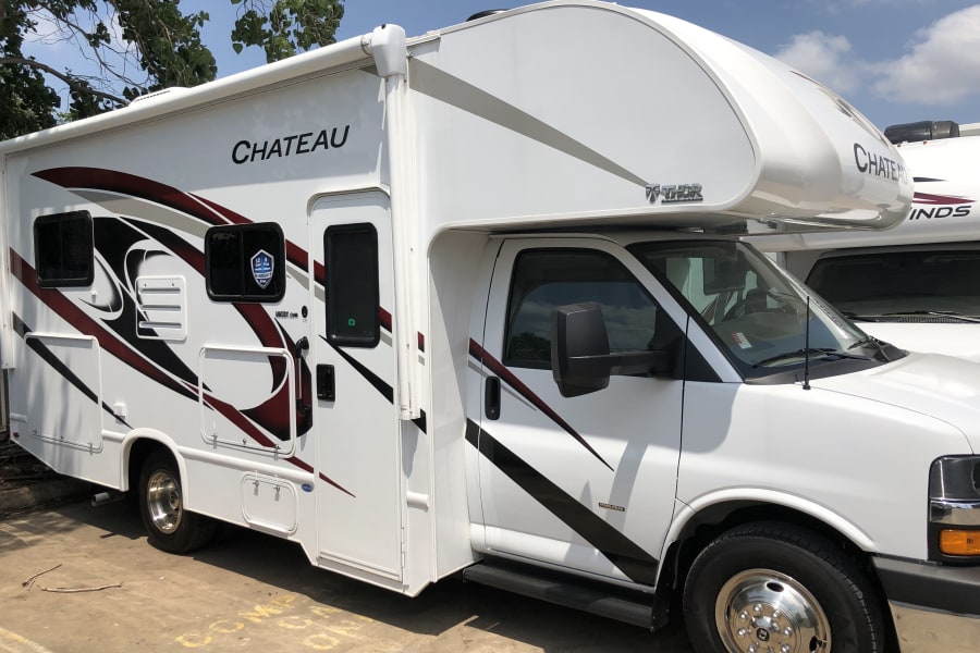 White Thor Chateau Class C RV for rent, showcasing its exterior graphics and design. Ideal for your next adventure.