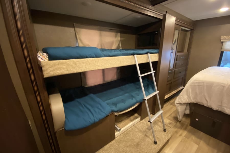 Bottom bunk can also convert to mini-dinette. Perfect for children to have their own space.