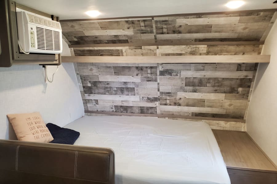 Queen size bed with mattress protector and fitted sheets included for queen bed and both bunks. (Sheets for dinette conversion not included).