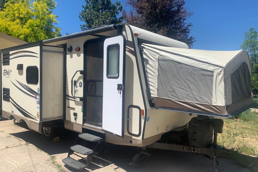 This Rockwood hybrid travel trailer RV rental, with its pop-out tent and extended awning, is ready for your adventure.