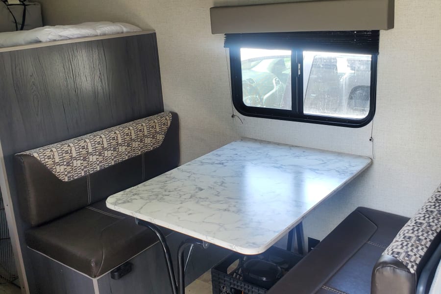 Seats 4, converts to full size bed.