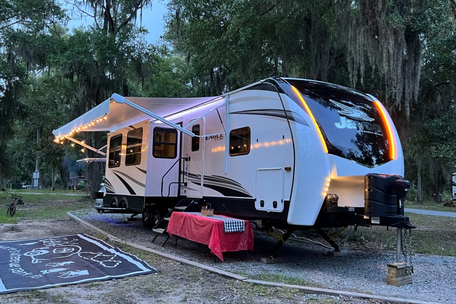 Stylish lighting & exterior features provide a luxury camping experience. 