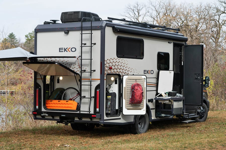 Explore this Winnebago EKKO rv rental's open storage, outdoor kitchen, and adventure gear setup.