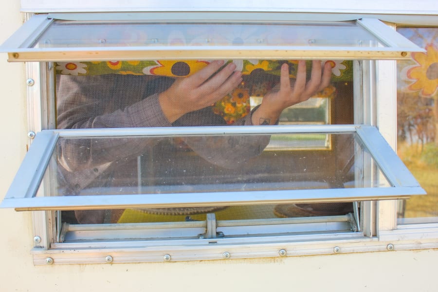 privacy please! the groovy floral curtains roll up for more sunlight or can stay down for darkness/privacy. all exterior windows crank open too!