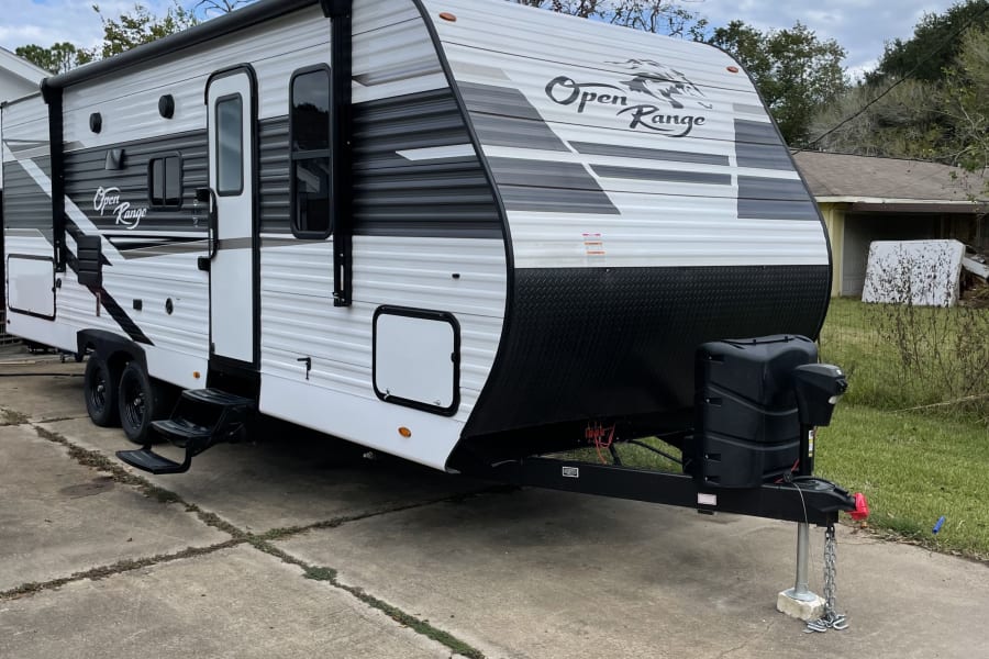 Ready for adventure! This sleek white and black travel trailer is ideal for your next RV rental road trip.